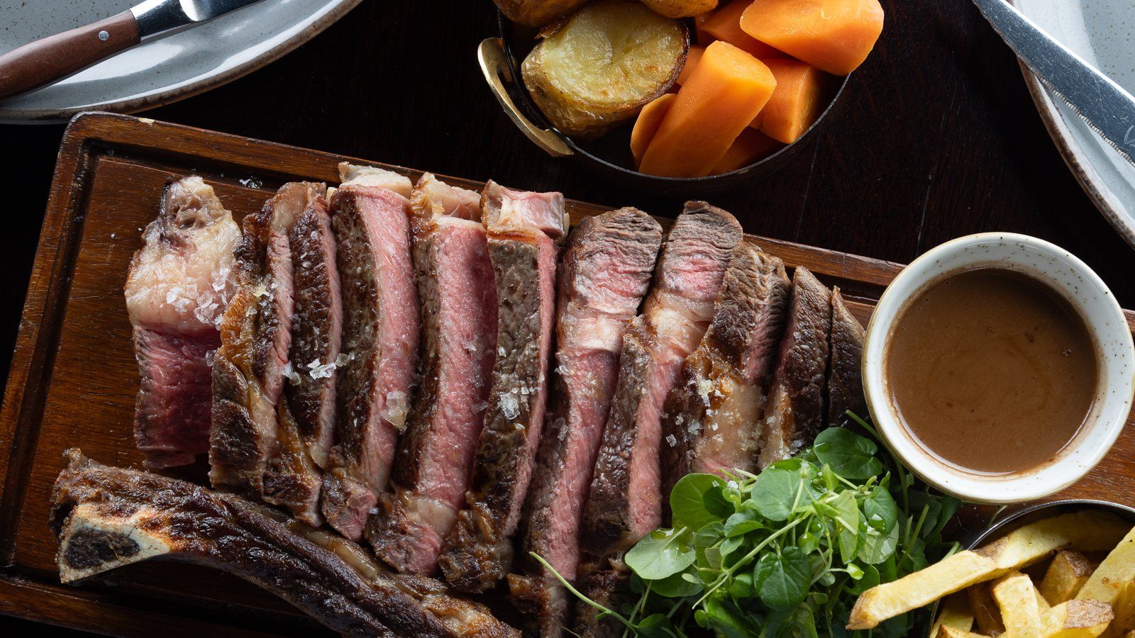 Sharing plate of steak in Mapas Restaurant